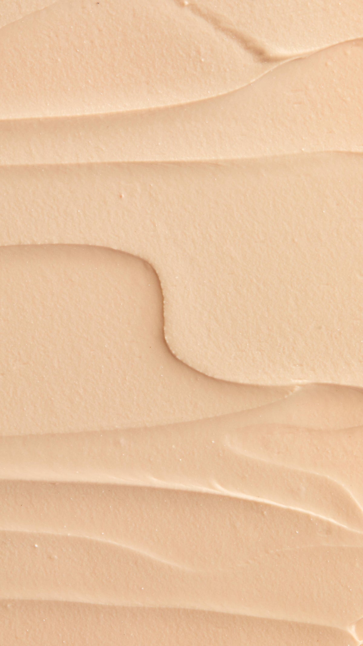 A super close-up image of the creamy, smooth Coconut Shie face mask product, focusing on the thick consistency.